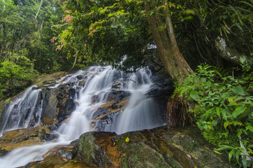 Fototapeta na wymiar beautiful in nature, amazing cascading tropical waterfall. wet a
