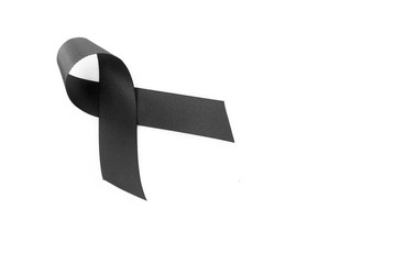 Black ribbon symbol for mourning on white background