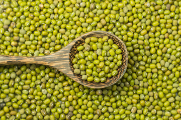 mung beans over wooden background