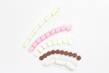 different medicinal pills on white background