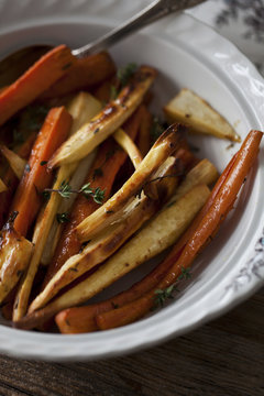Roasted carrots and parsnips in a bowl