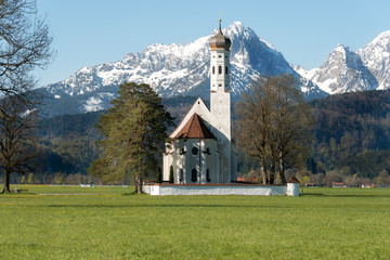 Landscape of church with snow mountain near Munich, Germany.