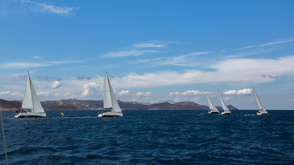Fototapeta premium Luxury yachts at Sailing regatta. Yachting in the wind through the waves at the Sea.