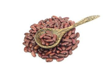 Red kidney beans on a wooden spoon isolate on white