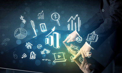 Man touching technology smart table with business icons