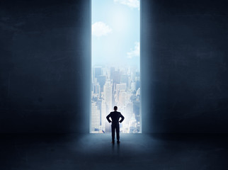 businessman in front of the huge gate