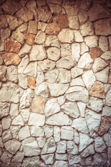 Texture old rock wall made of random stone