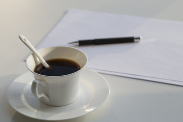 Business concept , blank paper and cup of fresh coffee on the table in office 