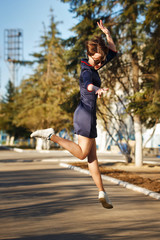 Girl jumping on the road in park