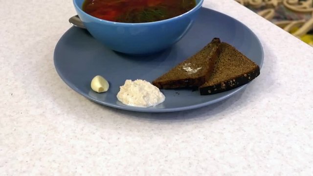 soup in a blue plate