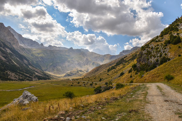 Fototapeta na wymiar Road through a valley in the Pyrenees
