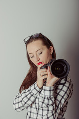 Fototapeta premium Woman-photographer takes images,