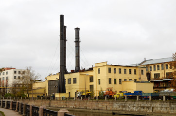 Fototapeta na wymiar Tall chimneys at the shipyards.