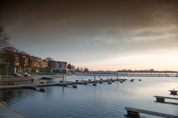 Yacht port over orange sunset