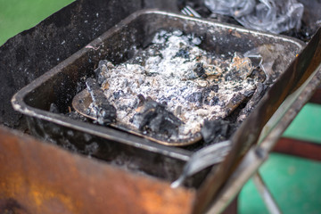 Charcoal in local stove in countryside.