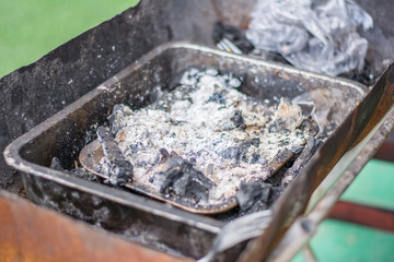 Charcoal in local stove in countryside.