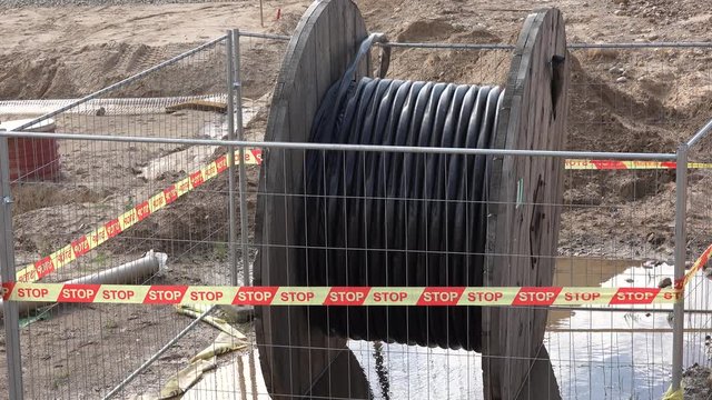 High voltage cable reel in wet dirt