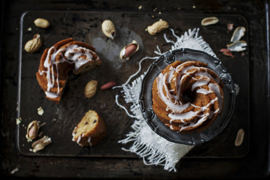 Swirl cake with frosting on rustic pan
