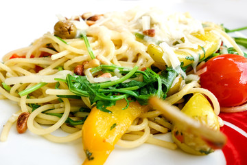 Spaghetti with aubergine and tomato on a the table
