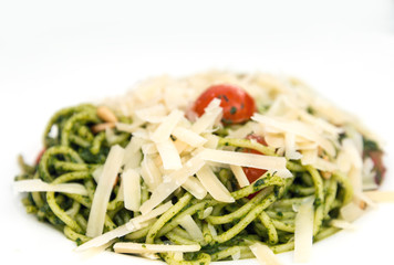 Pasta with pesto sauce and nuts on a the table