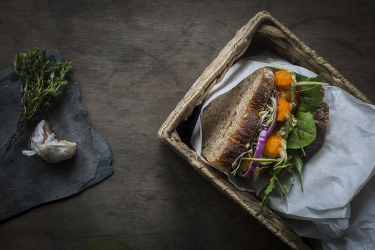 Vegan sandwiches for picnic with roasted carrots, pea spread, an