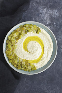 Roasted Anaheim Pepper Manchego Pesto in ceramic bowl on dark gr