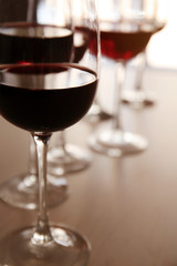 Glasses of red wine on table in restaurant