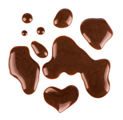 Set of multiple puddles of chocolate on white background