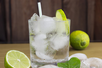 Gin and tonic cocktail with lime and ice