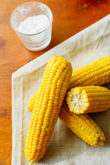 rustic concept just cooked corn with salt on table