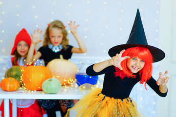 Happy group of children in costumes during Halloween party