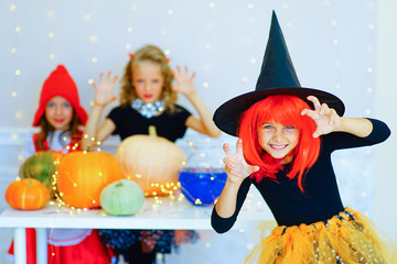 Happy group of children in costumes during Halloween party