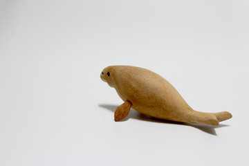 sculptured wood of the extinct Steller's sea cow isolate on white background.