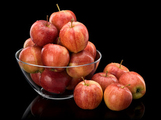 Crop of red apples in glass vase
