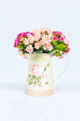 Vintage jug.flowers in vintage jar on white background.