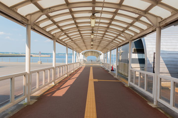Obraz premium walkway to harbor with tunnel nobody scene.