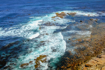 Ocean currents and strong waves at Cape Point. The powerful ocean surf in Atlantic Ocean. Cape of Good Hope - the most south-westerly point of Africa.