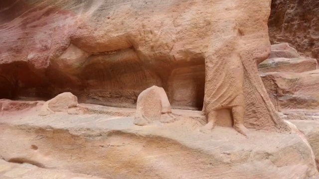 Ancient Nabataean Rock Carving Camel Rider Statue and Camel Caravans Ruins inside Al-Siq in Petra, Jordan. Petra is one the New Seven Wonders of the World. This is an UNESCO World Heritage Site.