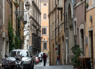 Fototapeta na wymiar Typical old and narrow street in Rome. Italy