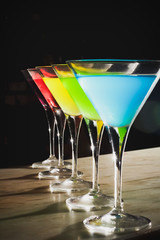 Multicolored cocktails at the bar.