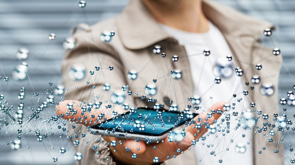 Businessman holding abstract connection interface over phone 3D