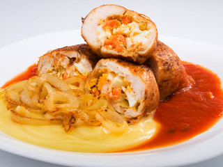 Chicken roulades stuffed with boiled eggs, carrots and onion. To