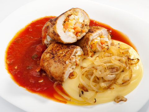 Chicken roulades stuffed with boiled eggs, carrots and onion. To
