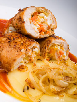 Chicken roulades stuffed with boiled eggs, carrots and onion. To