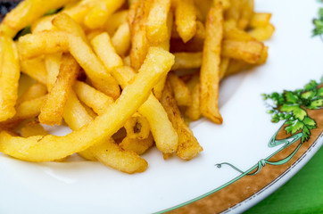 Golden French fries potatoes ready to be eaten
