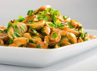 Salad with baked garlic and freshly chopped parsley.