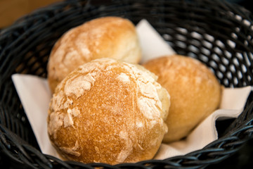 bread in basket - little roll breads in basket on table