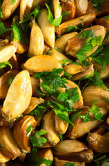 Salad with baked garlic and freshly chopped parsley. Vertical sh