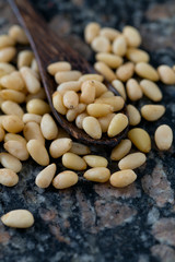 pine nuts on granite surface