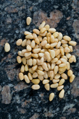 pine nuts on granite surface
